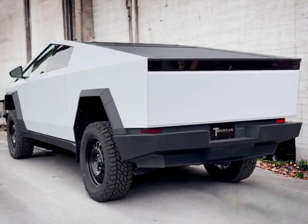 back of white satin tesla cybertruck in parking area