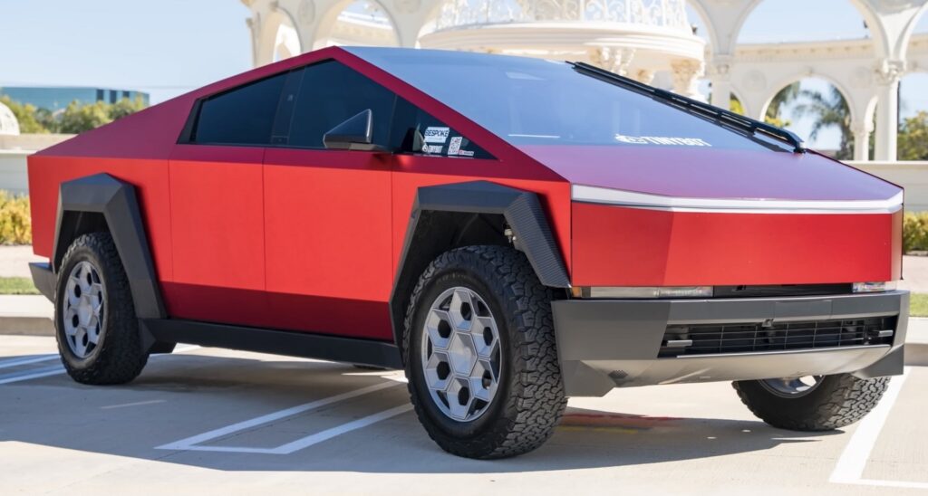  Metallic Red Cybertruck in parking area