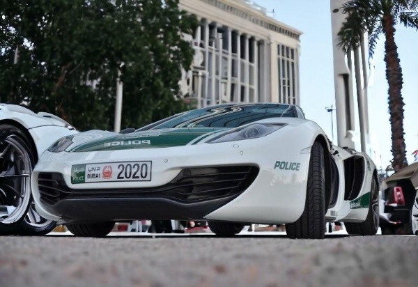 McLaren Artura police car parked outside a city building in dubai