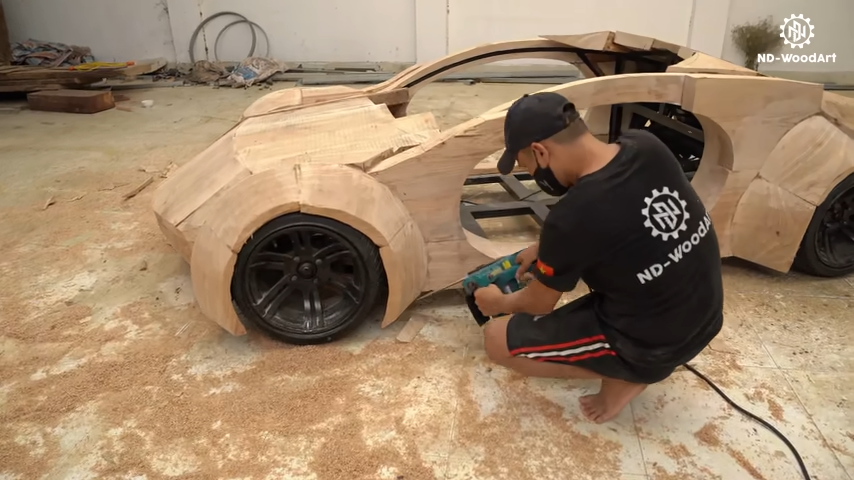 Father Crafts Wooden Apple Car for Son After Tech Giant Scraps Project